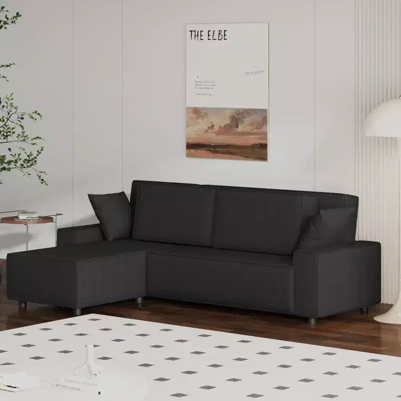 Divano sezionale a L in velluto a coste con pouf mobile