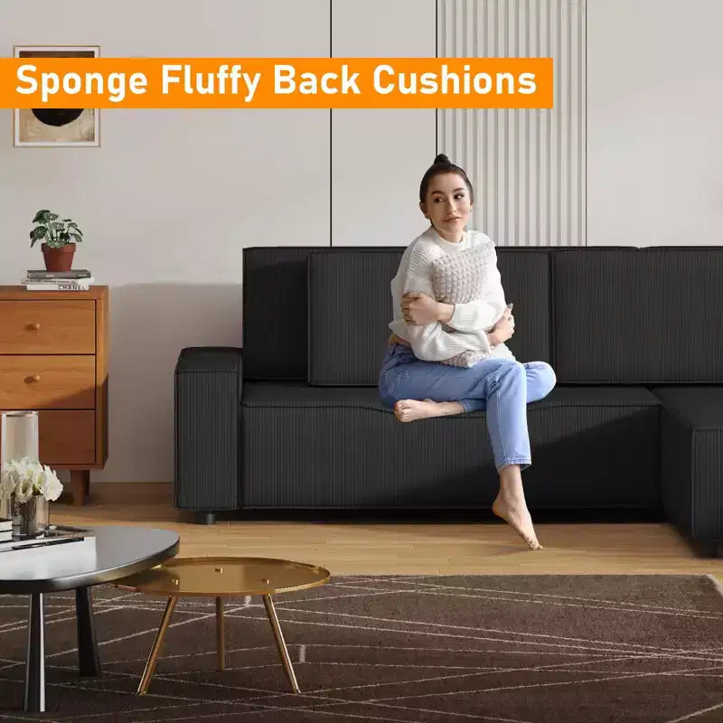 Divano sezionale a L in velluto a coste con pouf mobile