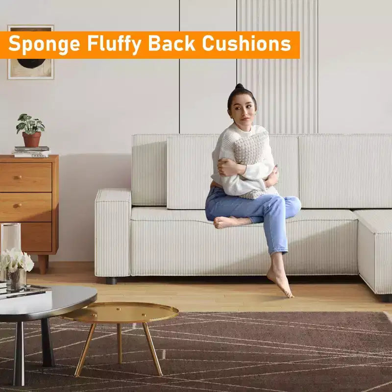 Divano sezionale a L in velluto a coste con pouf mobile