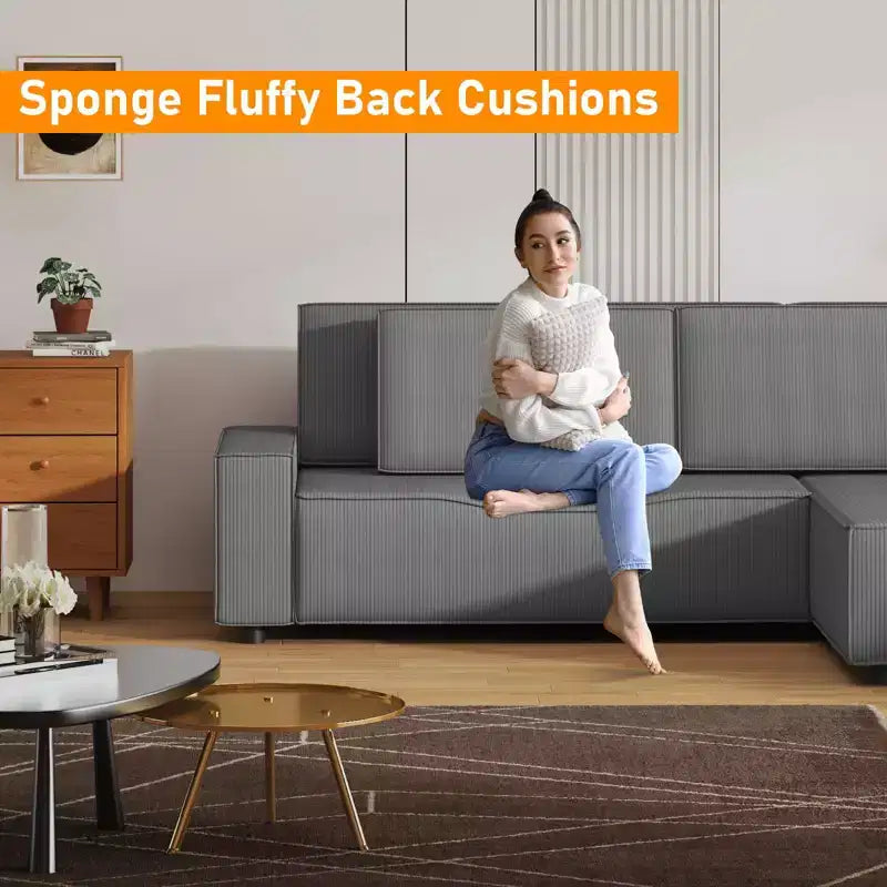 Divano sezionale a L in velluto a coste con pouf mobile